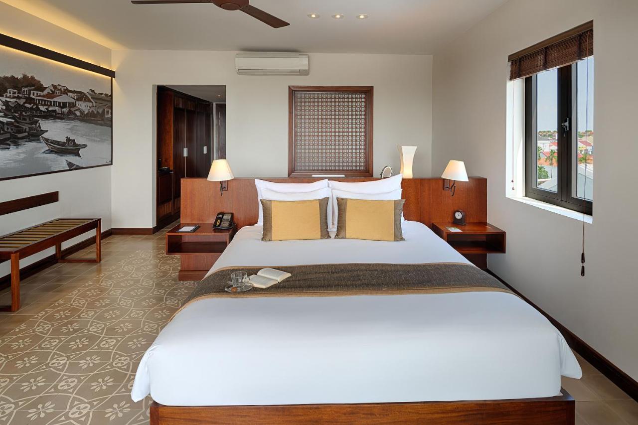 Rivertown Hoi An Resort & Spa Exterior foto A bedroom at the hotel