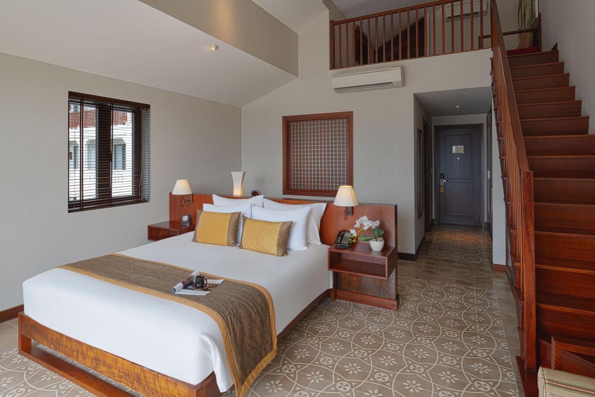 Rivertown Hoi An Resort & Spa Exterior foto A bedroom at the hotel